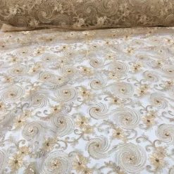Jasmine Lace Table Linen in Champagne
