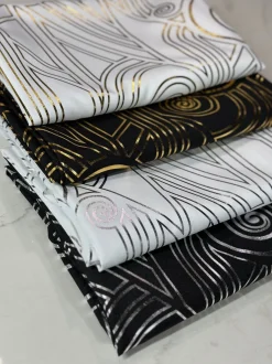 Luxor (Metallic Print) Table Linen in Black and Gold